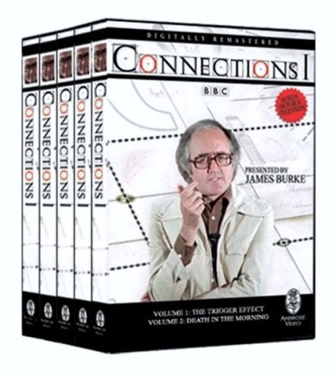 set of DVD boxes with a gray-haired white man with glasses who seems to be speaking thoughtfully