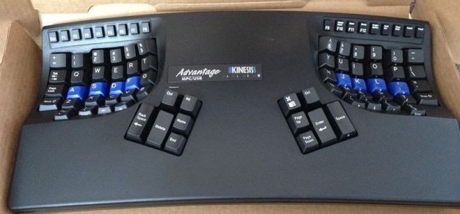 keyboard with keys split into two concave groups of keys, one group for each hand