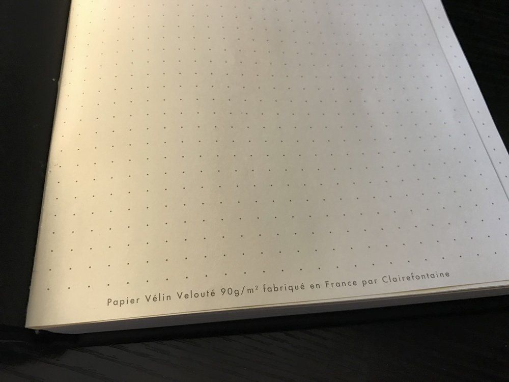 Rhodia proudly touts the quality of their paper right there on page one. The remainder of the pages are dot grid with no further markings. Page one is glued to the endpaper; it&rsquo;s the only page that doesn&rsquo;t really want to lie flat.