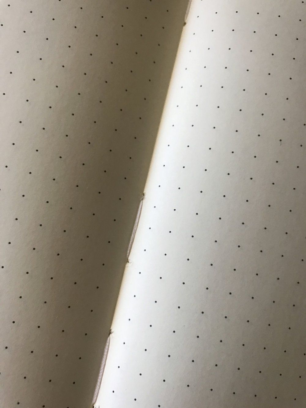 The Rhodia&rsquo;s stitched binding initially feels a bit tighter than that of the Leuchtturm1917, but after some simple breaking in, it lay flat quite easily.