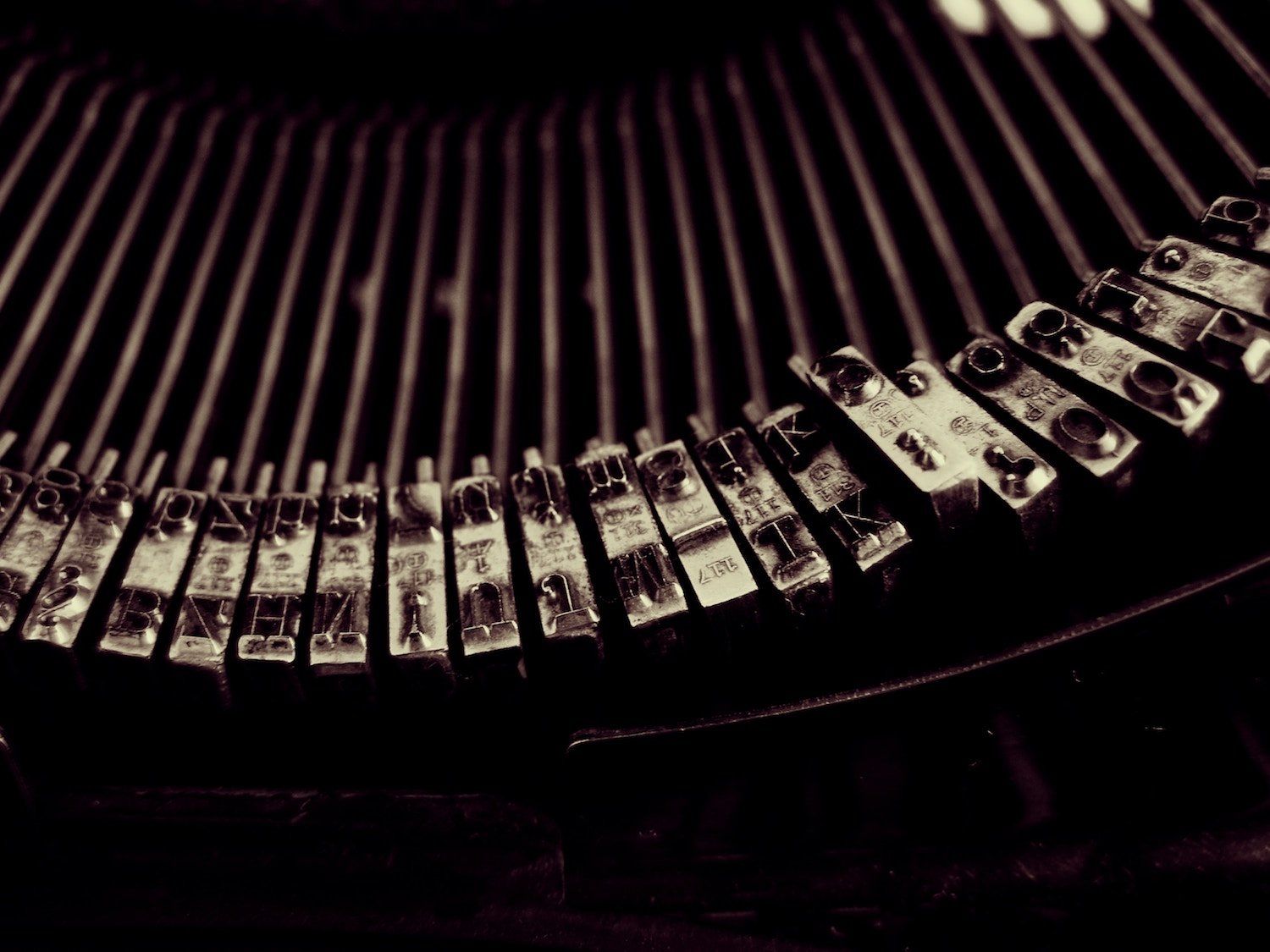 Close on old array of typewriter print keys