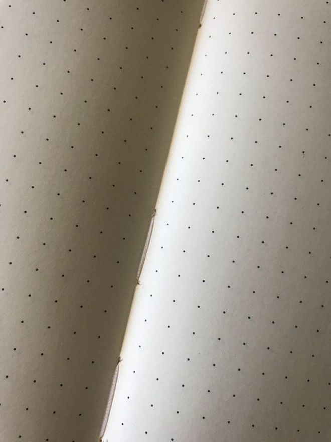 The Rhodia's stitched binding initially feels a bit tighter than that of the Leuchtturm1917, but after some simple breaking in, it lay flat quite easily.